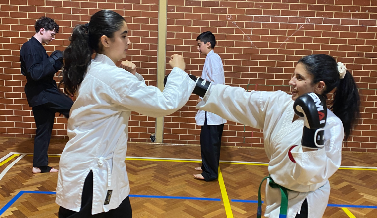 Adult martial arts training session at Tan Kyu Shin